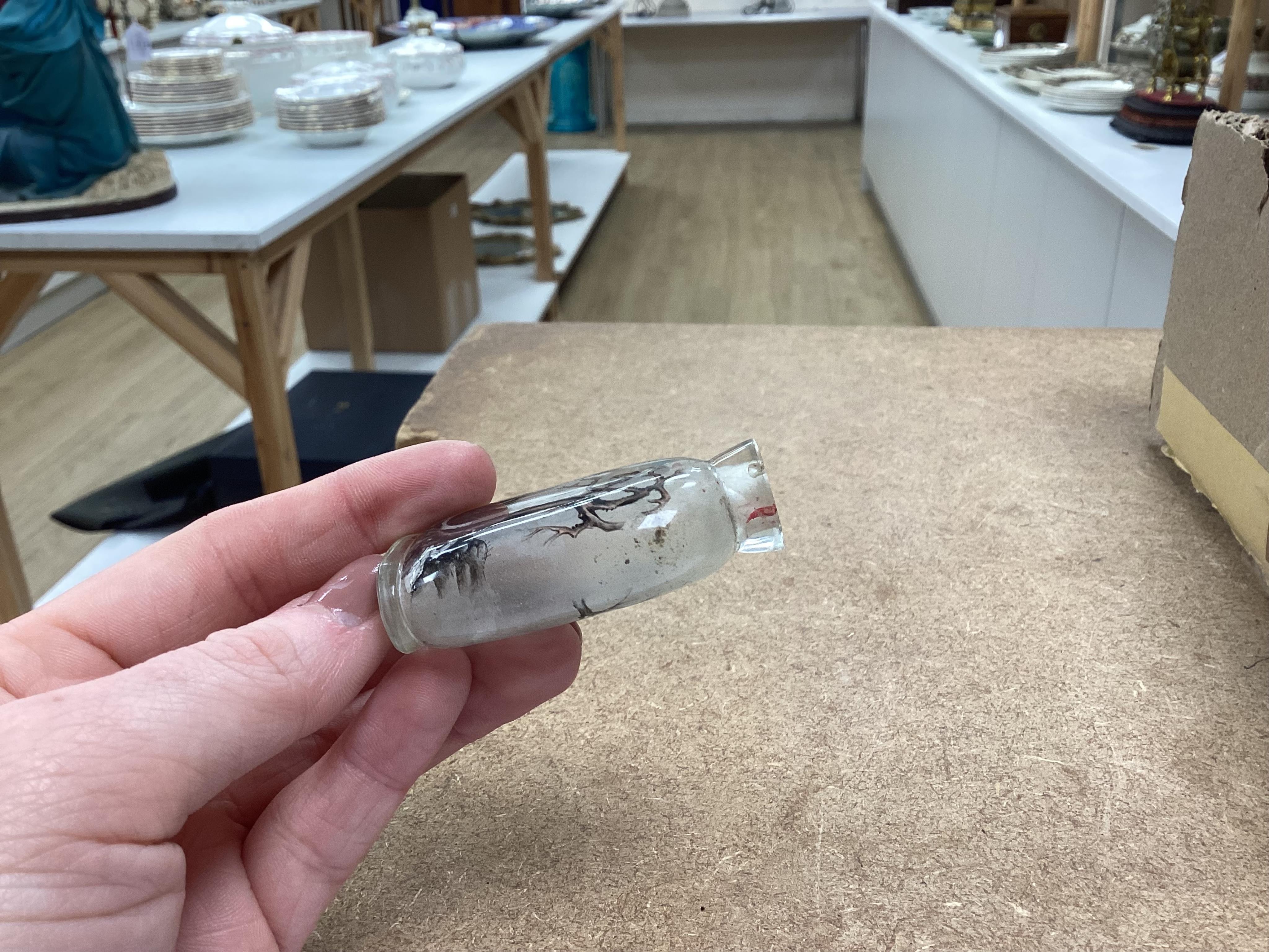A small collection of Chinese snuff bottles, 19th century and later to include reverse glass painted examples and cinnabar lacquered examples, largest 9.5cm high